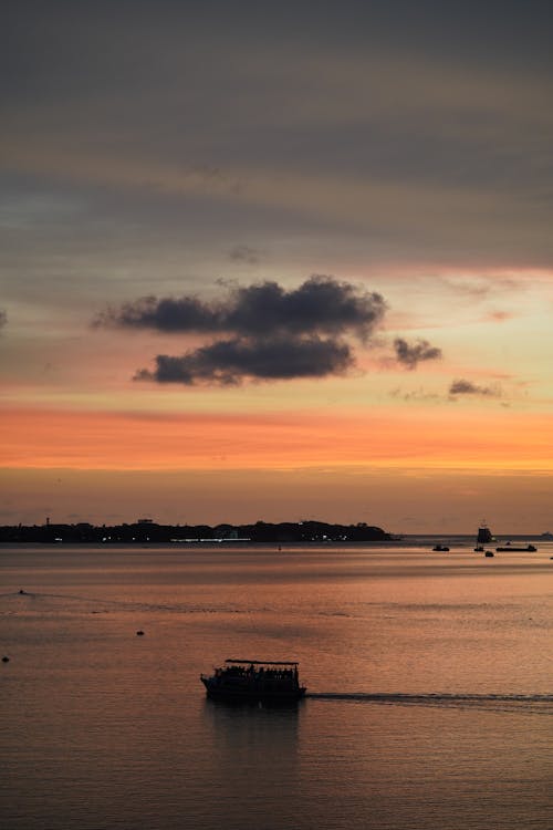 Ships Sailing in the Sea at Sunset 