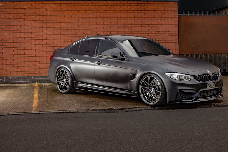 Black Bmw Car Parked Sideways