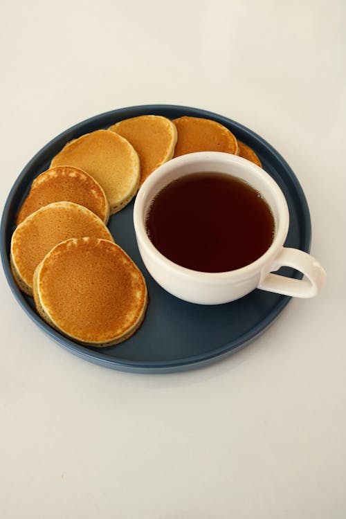 Free Pancakes and Chocolate Drink on a Blue Plate Stock Photo