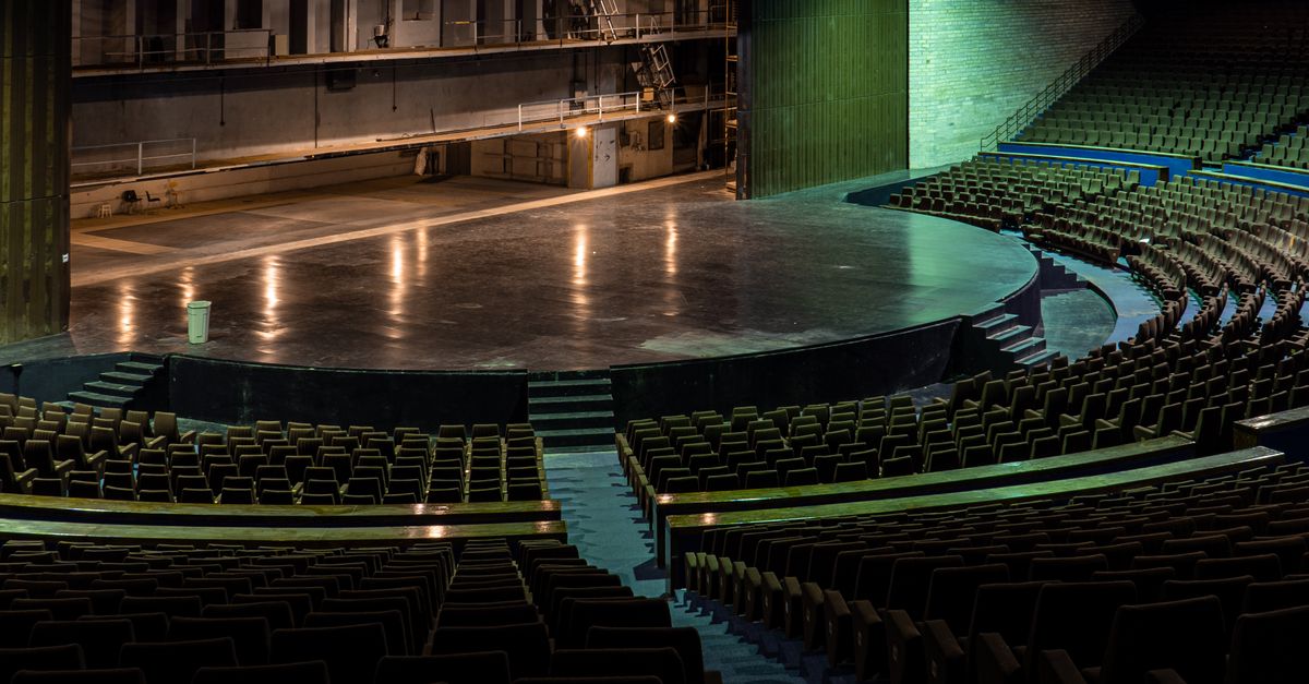 Interior of Christ Embassy Loveworld Arena in Ho showing the stage and seating