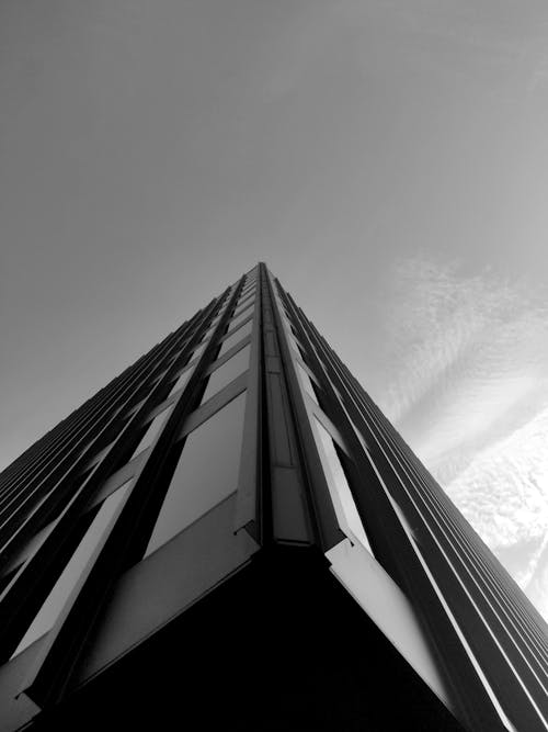 

A Grayscale of a Building under a Clear Sky