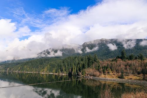 Free Explore the breathtaking landscape of mountains and serene lake reflection in North Vancouver, Canada. Stock Photo