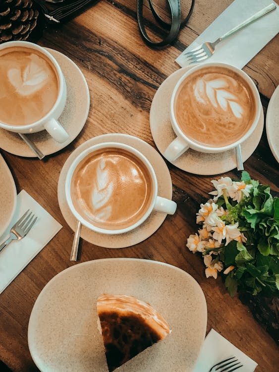 Free Cups of Coffee on the Wooden Table Stock Photo