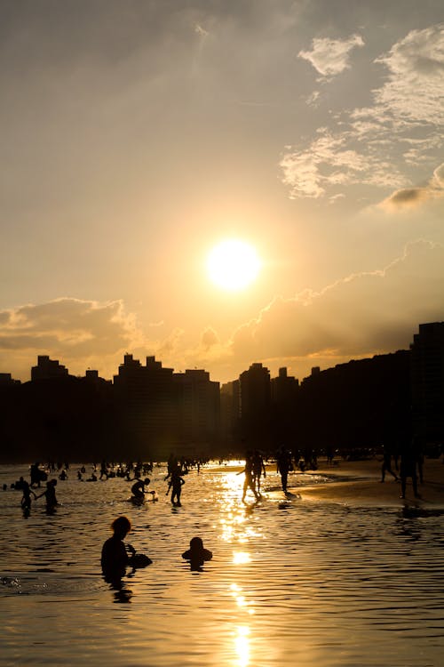 People on Beach during Sunset