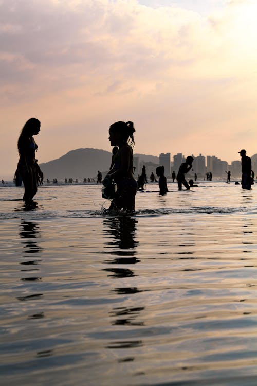 
A Silhouette of People at the Beach