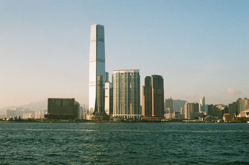 Free Breathtaking view of Kowloon's skyline featuring iconic skyscrapers and waterfront landscape. Stock Photo
