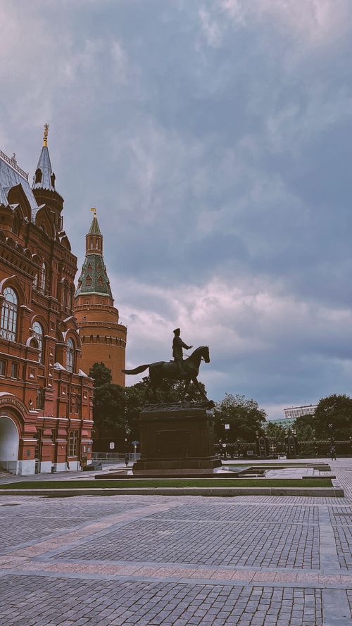 Free Statue of Marshal Zhukov near the State Historical Museum in Moscow, Russia, under a cloudy sky. Stock Photo
