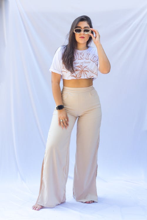 Woman in White Crop Top and Sunglasses