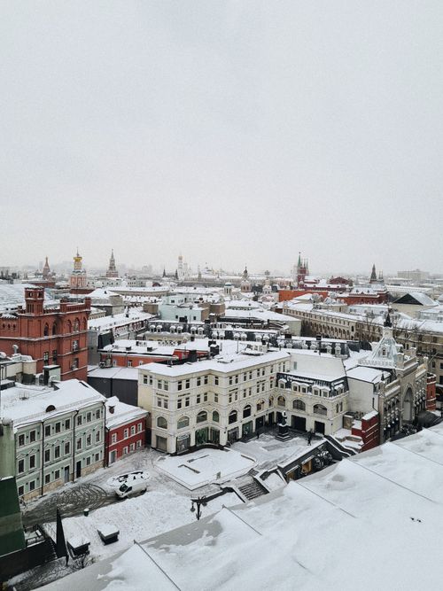 Free Aerial view of Moscow's cityscape in winter, showcasing snow-covered historic architecture. Stock Photo