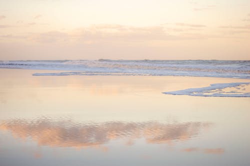 Dreamy Sunset Sky Reflecting in the Seashore 