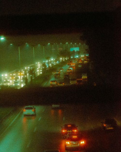 Free Busy highway in Algiers at night with traffic lights illuminating cars and the road. Stock Photo