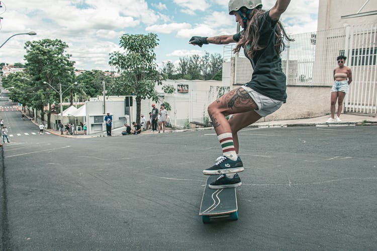 A Woman Riding A Skateboard