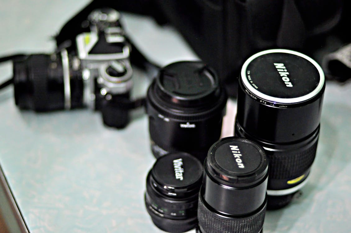 Free Four Black Nikon Zoom Camera Lens Stock Photo