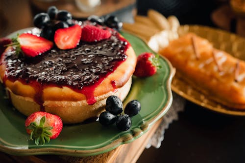 Cheesecake with Blueberries on Green Ceramic Plate