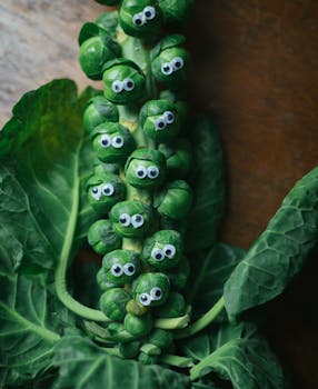 Fun and quirky Brussels sprouts decorated with googly eyes, shot close-up.
