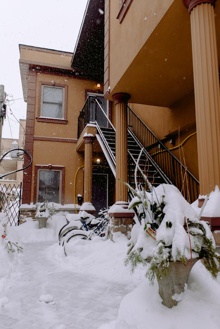 Bikes Parked On A Snow Covered Porch