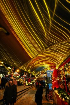 Vibrant Christmas market in St. Petersburg, Russia, adorned with glowing lights and festive decorations.