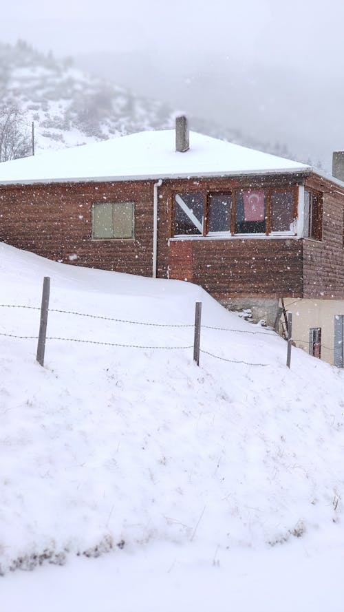 Brown Brick House Covered With Snow