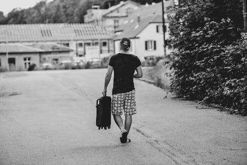 Backview of Man waking on Road 