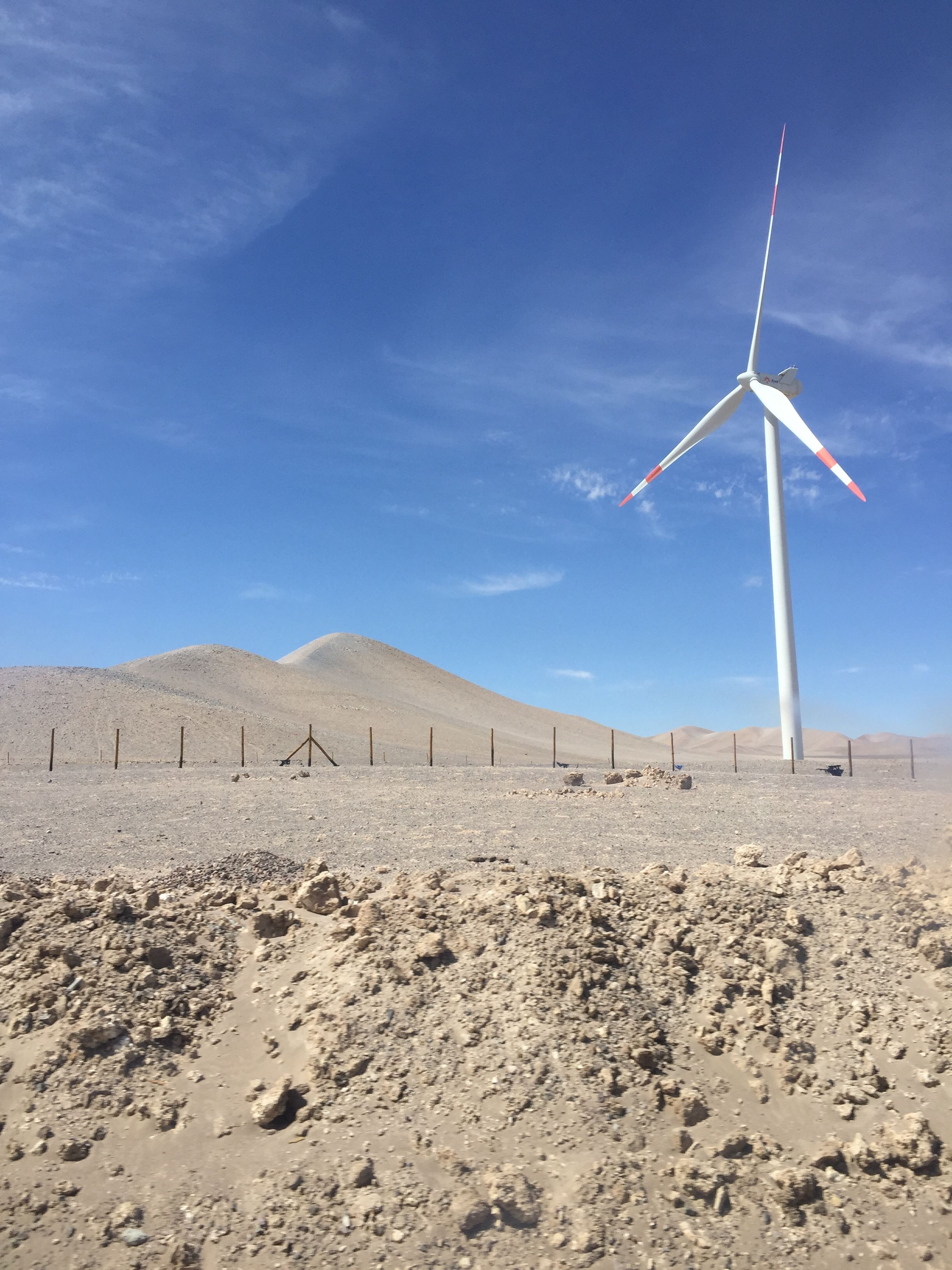 White Wind Turbine on Brown Sand Under Blue Sky · Free Stock Photo