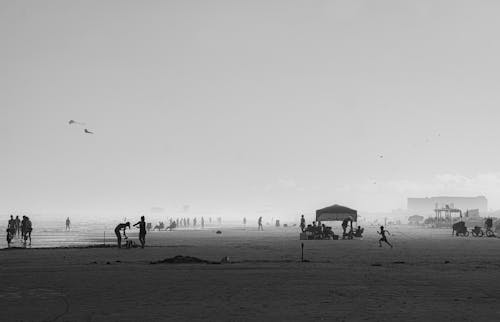 Black and White Photo of People at the Beach