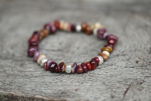 Red Beaded Bracelet in Close Up Shot