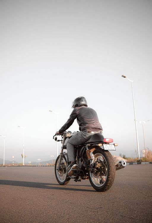 Person Rider A Person Riding a Motorcycle on the Road · Free Stock Photo