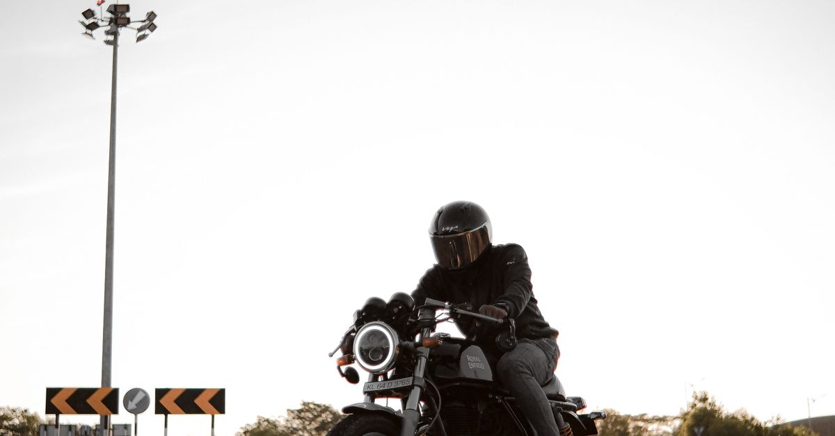 Person Rider A Person Riding a Motorcycle on the Road · Free Stock Photo