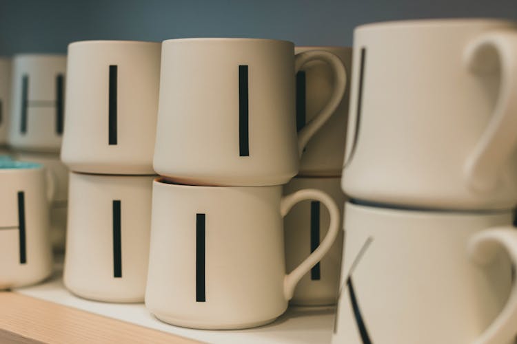 Photograph Of Cups With Letters