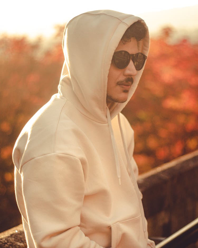 A Man With Black Sunglasses Wearing A Hoodie