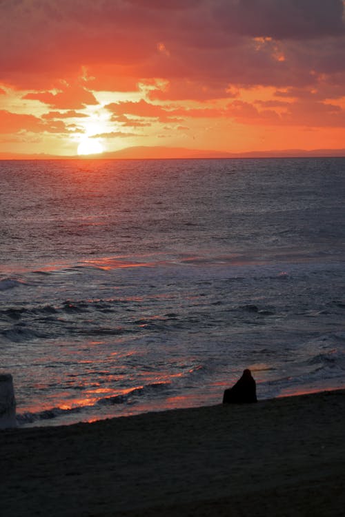 Beautiful Sunset Over Body of Water