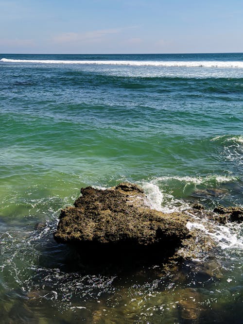 Brown Rock Formation on Sea Water