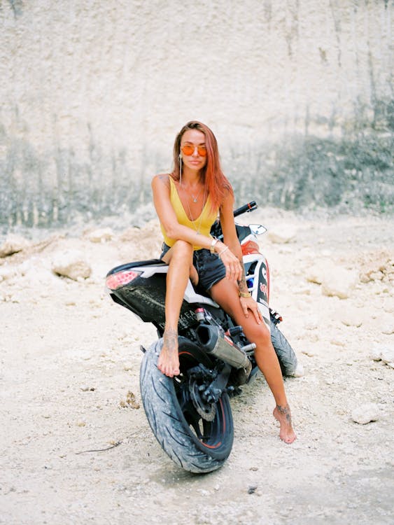 Free Woman in Sunglasses Sitting on Motorcycle Stock Photo