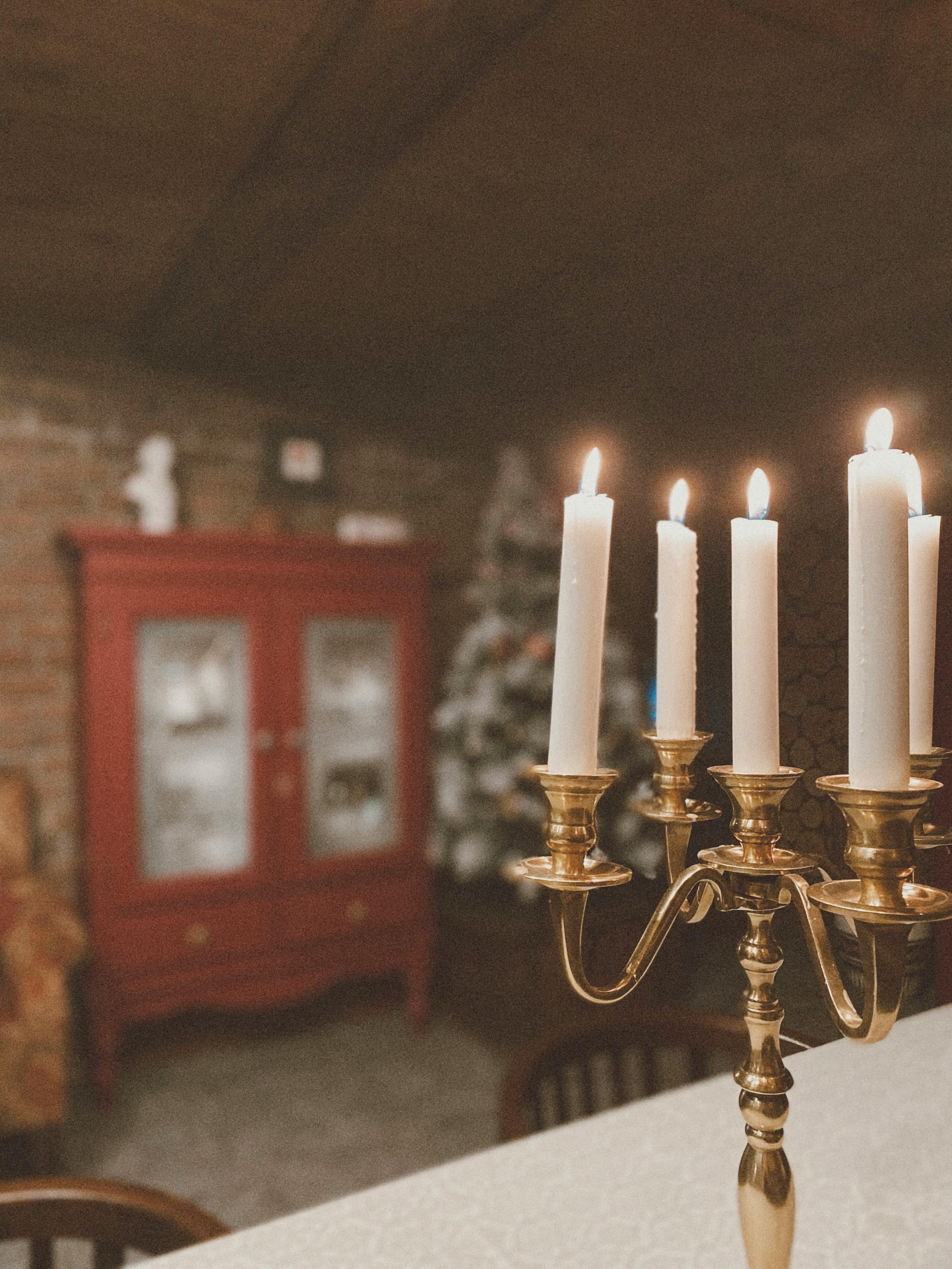 Free Lighted Candles on a Gold Candle Holder Stock Photo