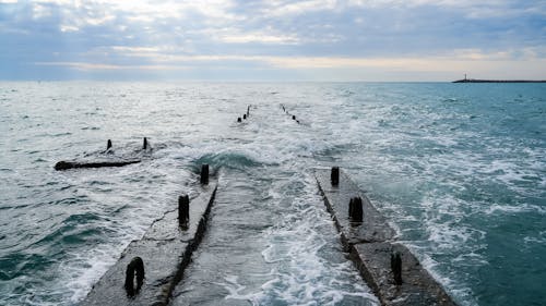 Crashing Waves on Concrete Breakwater on Sea