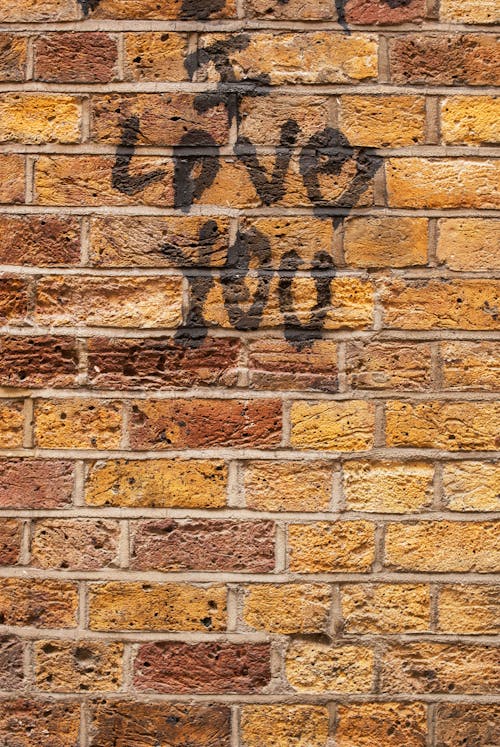 Photograph of I Love You Text on a Brick Wall