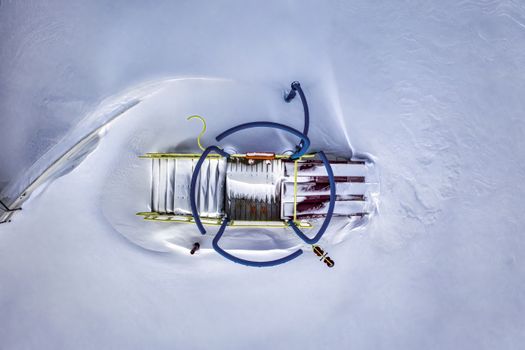Aerial view of a snow-covered playground captured in winter, showcasing a unique perspective.