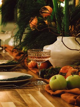 Exquisite table setting with glassware, fruits, and lush greenery in Saint Petersburg.
