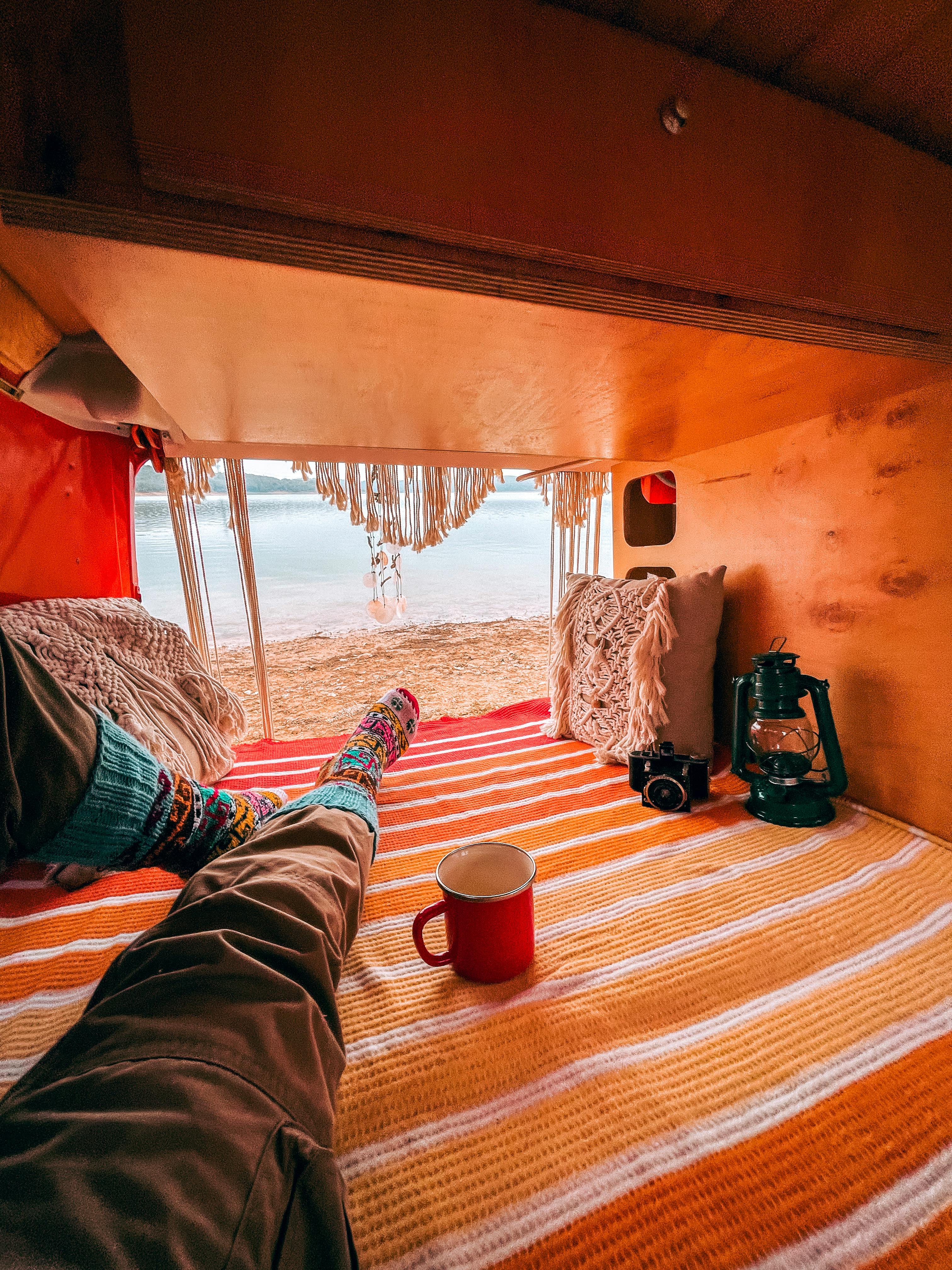 Relaxing inside a camper van with beach view in Esenceli, İstanbul, Turkey.