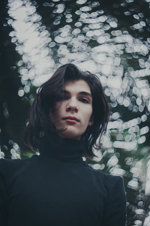 Low-Angle Shot of a Man in a Black Turtleneck Shirt