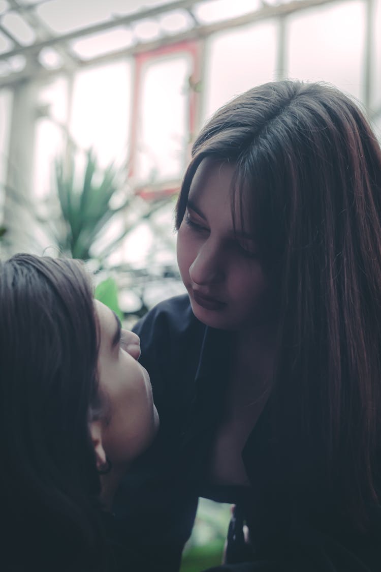 Photo Of A Woman Kissing A Man