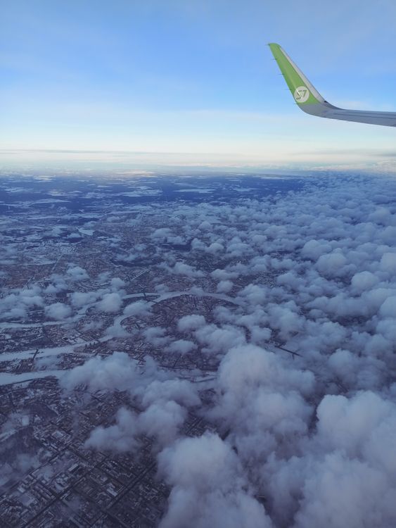 An Airplane Wing over the White Clouds · Free Stock Photo