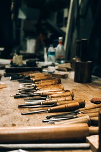 Chisels laid out on a workbench, photo by Lokman Sevim on Pexels