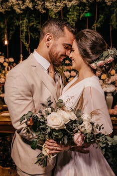 Couple shares a joyful moment during their elegant wedding night.