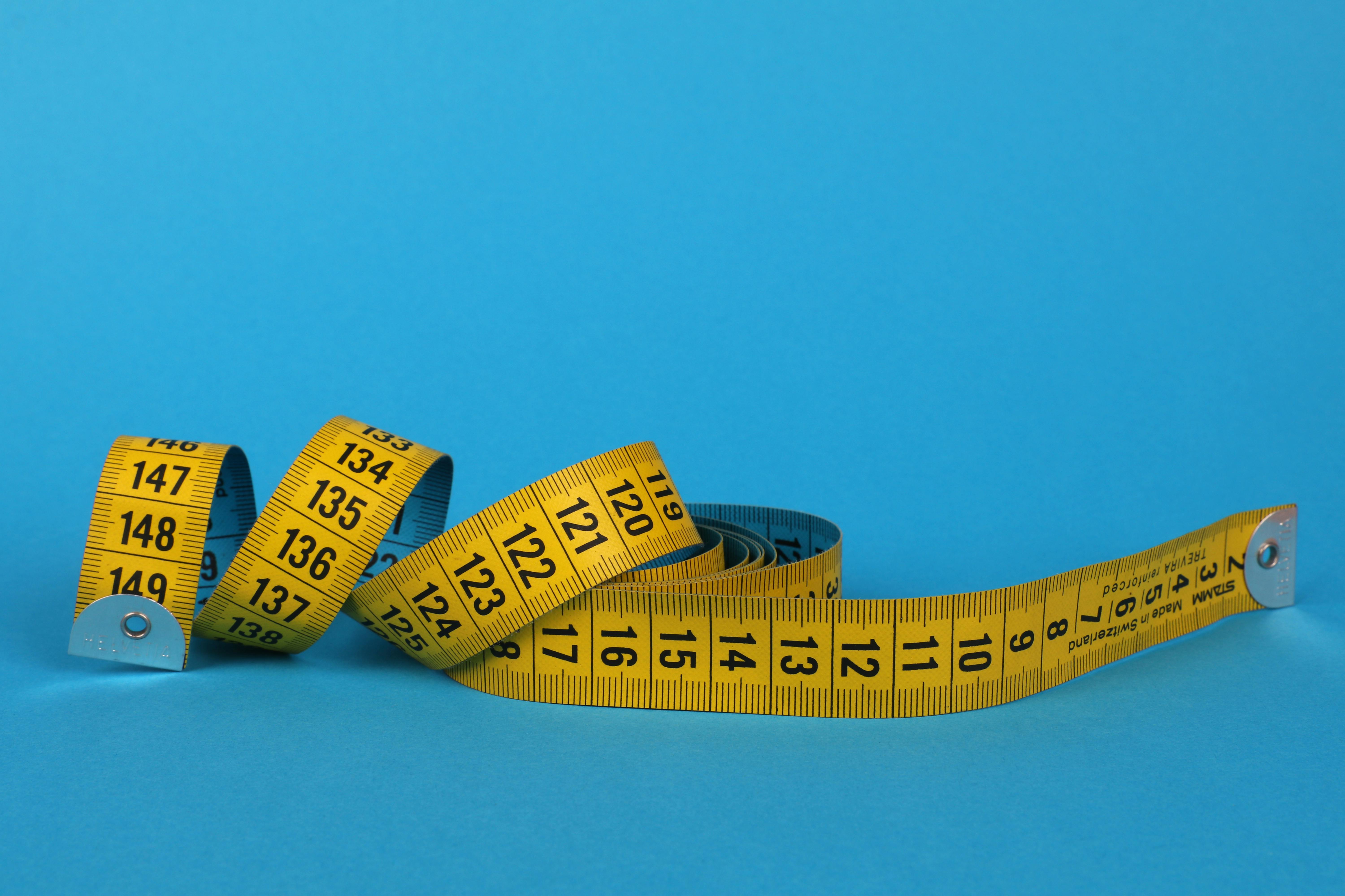 Measuring Tape Wrapped Around A Apple Weight Loss Photo Stock Photo,  Picture and Royalty Free Image. Image 32340153.