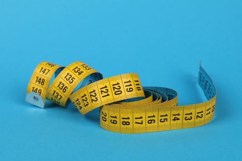 Tape Measure on Blue Surface