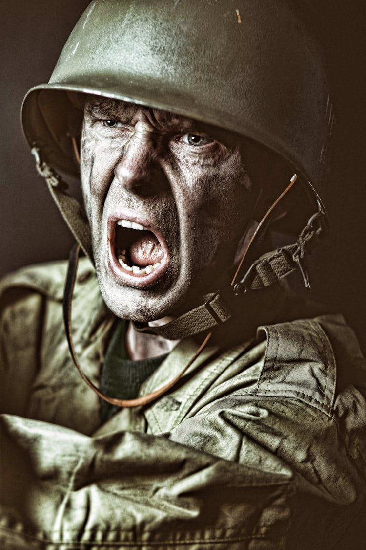 A Man Wearing Army Helmet Screaming