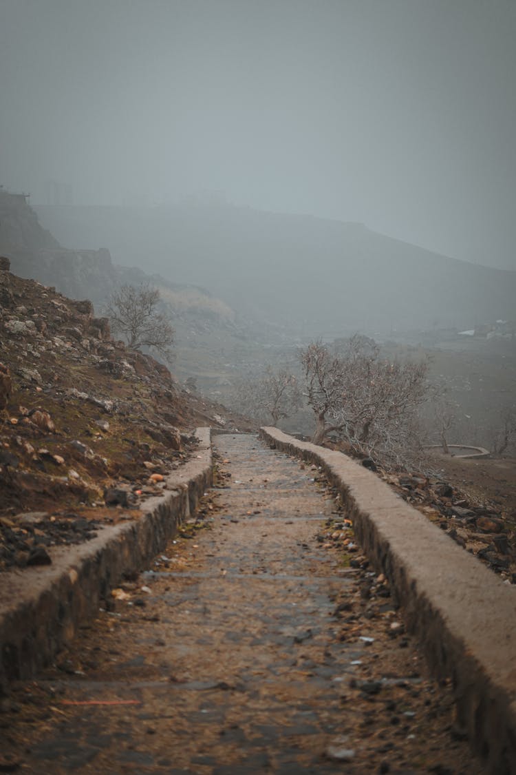 Brown Dirty Path Near Foggy Mountains 