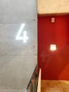 White and Red Wall With White Light Switch