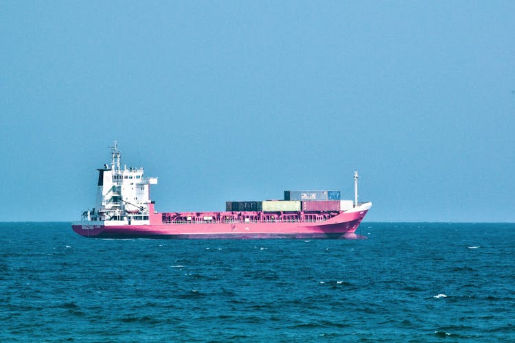 Cargo Ship Cruising On Sea